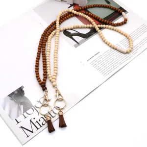 Fashionable wood bead beaded lanyard with brown tassels and gold ID badge clips