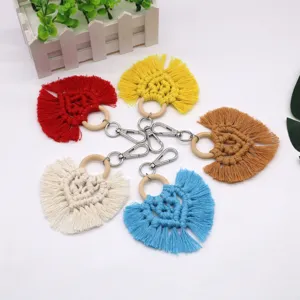 Handmade macrame heart keychain with colorful cotton tassels and wooden ring charm