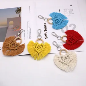 Handmade macrame heart keychain with colorful cotton fringe tassels and a wooden ring