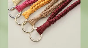 Close up shot of multi-color woven macrame phone wrist straps with durable metal rings.