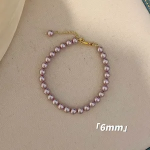 Elegantes 6mm lila rosa Perlenarmband mit verstellbarem goldfarbenem Verschluss-Design