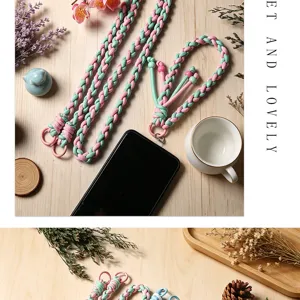 Close-up detail of hand-woven pink and green cotton phone lanyard with sturdy metal hook