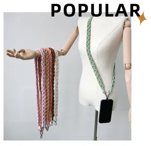 Long hand-woven macrame phone lanyard shown as a crossbody strap on a mannequin
