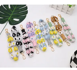 Handmade bohemian style macrame daisy flower phone wrist straps in multiple colors