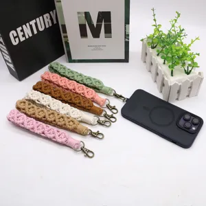 Set of colorful handmade macramé wrist straps with metal clasps for phones and keys