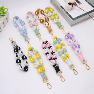 Handmade bohemian woven daisy flower phone strap and wrist lanyard with gold clasp