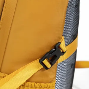 Detailed macro view showing the yellow outdoor hiking backpack buckle and side mesh pocket
