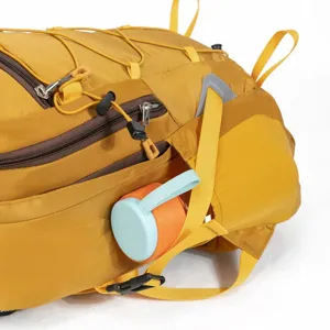 Close-up detail of lightweight outdoor hiking backpack side pocket holding a travel mug