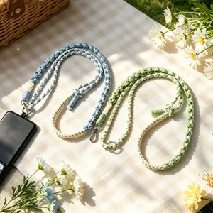 Braided phone lanyard adjustable crossbody strap for women, stylish phone charm chain.