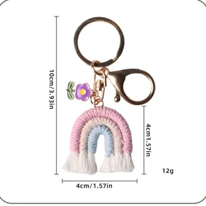Handmade crochet rainbow keychain charm with size measurements 10cm by 4cm