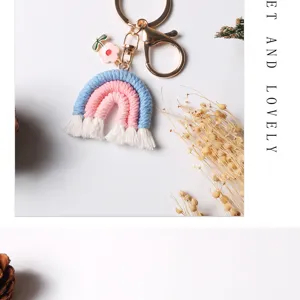 Handmade crochet rainbow tassel keychain bag charm with a pink flower charm accessory