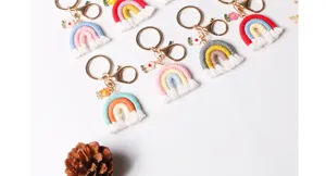 Handmade macrame rainbow keychains with tassels and floral charms in various colors