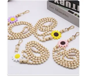 Detail of handmade wooden bead lanyards with colorful silicone sunflower accents