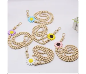 Detailed layout of handmade wooden bead lanyards with colorful silicone daisy pendants
