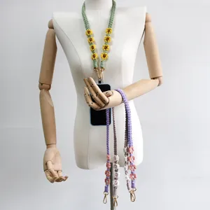 Handmade macrame phone lanyard with daisy floral pattern and durable double metal clips