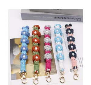 Handmade colorful crochet flower wrist straps with pearl centers and gold clasps.