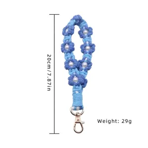 Handmade blue daisy flower macrame wrist strap with pearls and metal clasp