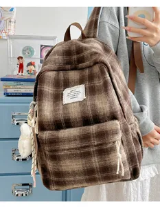 Detail view of retro brown plaid fuzzy backpack, soft plush texture, ideal for daily student use.