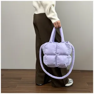 Detail view of the soft lavender quilted puffer tote bag with a long shoulder strap