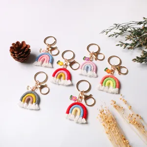 Handmade macrame rainbow keychains with tassels and floral charms for bag decoration