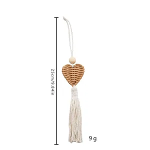 Dimensions of bohemian handmade heart rattan wall hanging with cotton tassel.