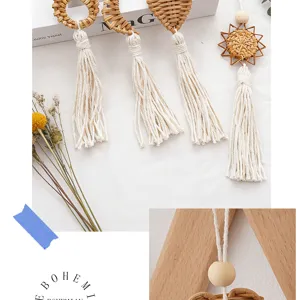 Close-up detail of handmade bohemian rattan woven shapes with white cotton rope tassels