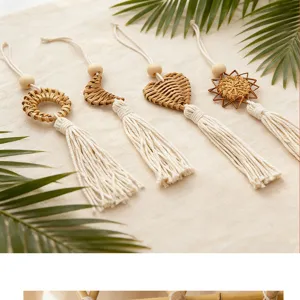 Detail of handmade Bohemian rattan wall hangings with cotton tassels in various shapes