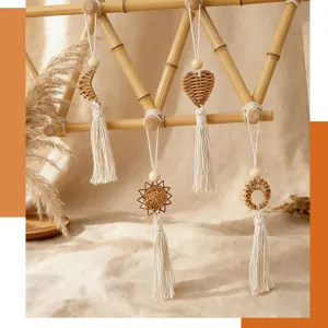 Handmade bohemian rattan woven wall ornaments set with cotton tassels and wood beads.