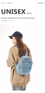 Detail shot of a light blue washed denim small backpack worn by a model