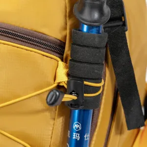 Close-up of lightweight hiking backpack showing the secure trekking pole attachment.