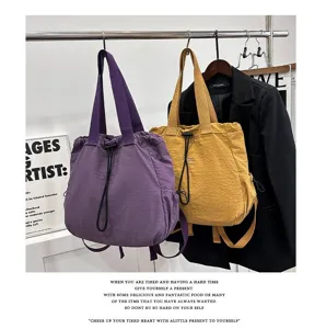 Detailed view of the casual nylon tote backpack featuring dual straps and drawstring closure.