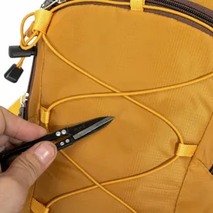 Close-up of durable tear-resistant nylon fabric on yellow outdoor hiking backpack
