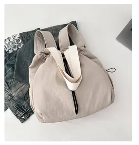 Detailed view of casual large capacity nylon backpack, solid color minimalist student schoolbag