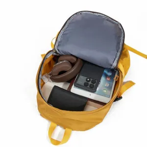 Detailed interior view of a yellow large capacity travel backpack showing storage space