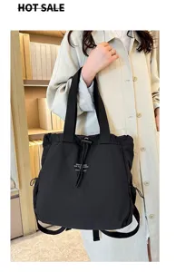 Detail view of a stylish casual black nylon backpack, large capacity student school bag.