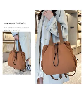 Large capacity casual nylon backpack stylish commuter bag detail view in brown color