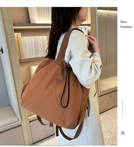 Casual large capacity nylon backpack for women, stylish daily commuter school bag brown.