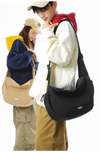 Detailed view of fashion crossbody dumpling bag worn by models for daily commute