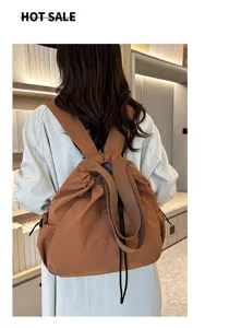Casual nylon backpack detail showing back wear, large capacity daily commuting style.