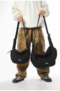Black crossbody dumpling bags shown in two sizes for casual and sporty everyday use.