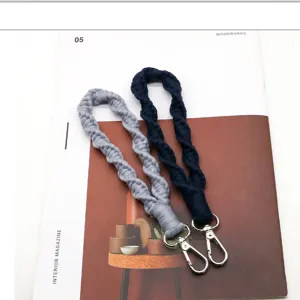 Detailed view of woven wrist keychain, soft braided cord lanyard with metal clasp for daily use.