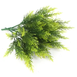 Macro detail of artificial pine needles with realistic green gradient texture.