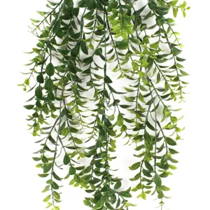 Close-up detail of lush artificial hanging Persian leaf greenery vine for wall decor