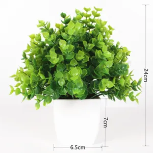 Artificial eucalyptus plant in white pot fake green plant for indoor outdoor home decoration.