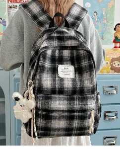 Classic black and white plaid backpack with front pocket, retro Japanese style bag.
