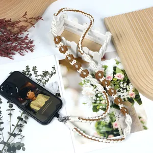 Handmade bohemian woven flower phone lanyard strap with daisy and pearl details