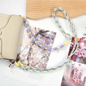 Handmade colorful braided phone lanyard with floral charms for crossbody bag and camera strap