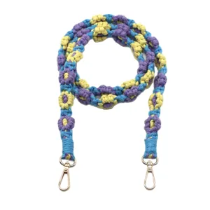 Handmade Bohemian woven floral phone strap in blue, yellow, and purple with gold lobster clasps.