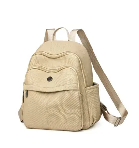Detailed close-up of the beige backpack featuring unique woven texture and pockets