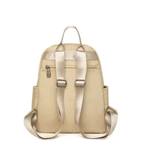 Detailed rear view of a minimalist solid beige backpack featuring adjustable straps